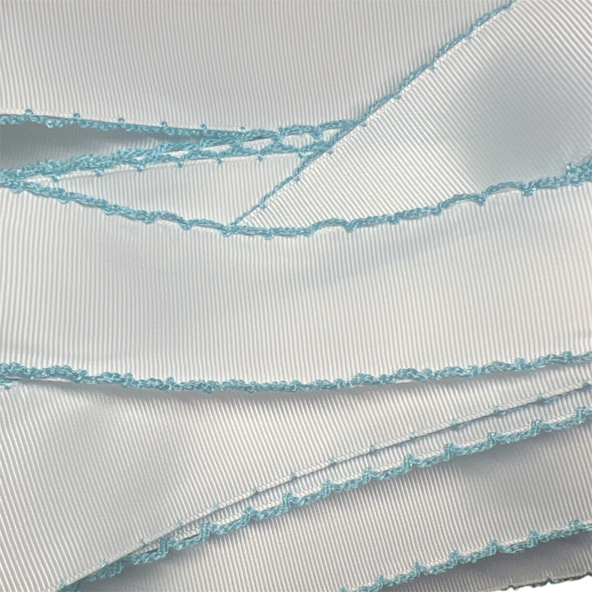 1.5" white with aqua blue moonstitch